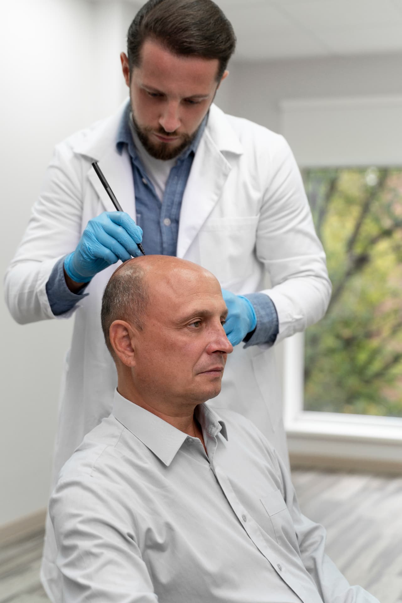 Practitioner performing a follicular unit extraction procedure